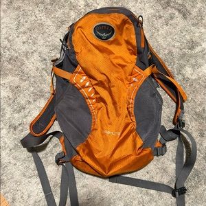 Orange small backpacking osprey bag